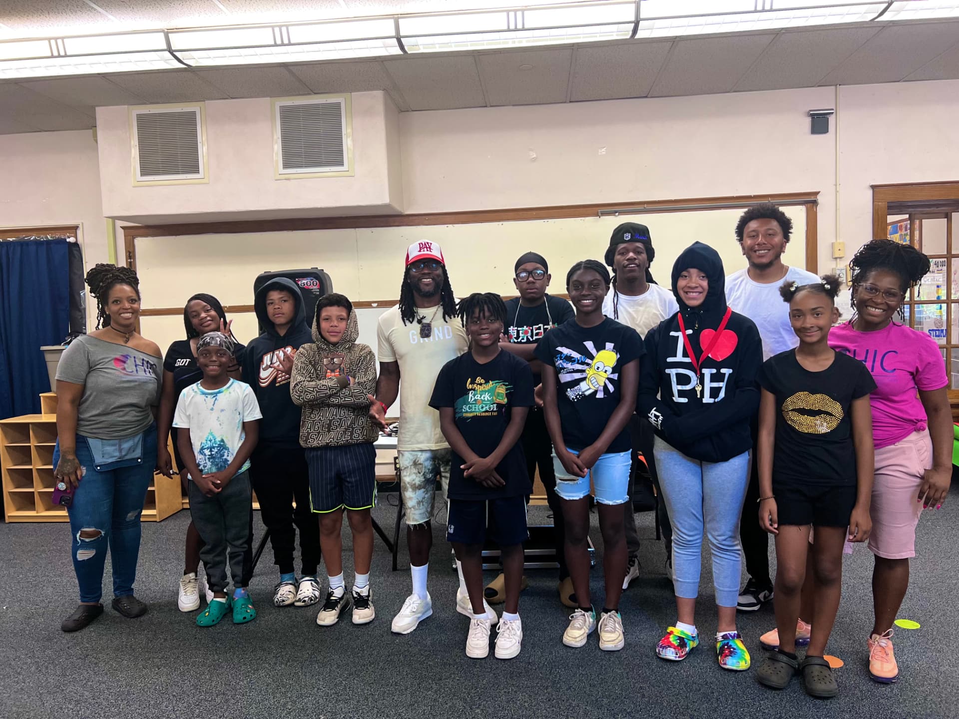 A L.I.F.E. cohort of young people and facilitators standing together after a session
